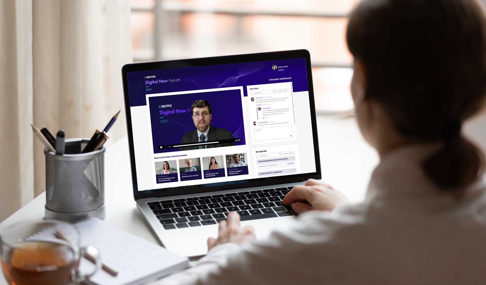Virtual events A business person working from home attends a virtual conference.